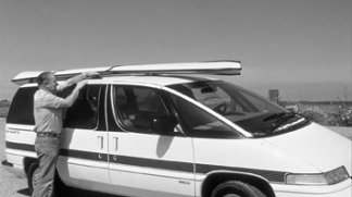 Rigid-hulled inflatable on top of the car
