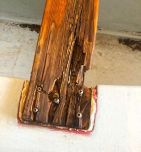 a thwart, this one terribly rotted, meant to reinforce the centerboard trunk, is typical of the boat’s original woodwork.