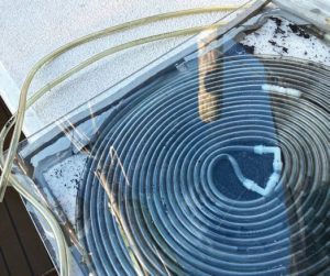 the new system uses tubingsandwiched between foam and Plexiglas
for heat retention.