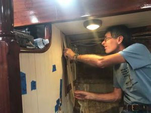 Jeremy installs one of the ash slats on the bulkhead.