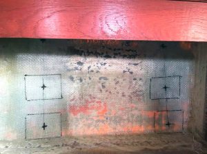 the same port bulkhead after sanding andlaying fiberglass reinforcements. The new chainplates alignments are drawn and the G10 backplates are ready to be glued in.
