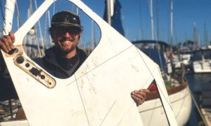 Chris happily takes the old Formica countertops off the boat.