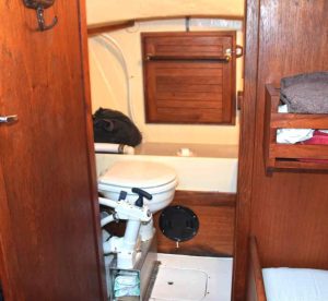 the head is inthe forepeak, where
headroom is limited, but
it’s seamanlike for boys
to also sit to pee.